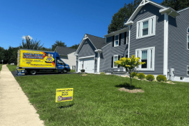 House on street with Fixed Right & Guaranteed sign in the front yard.