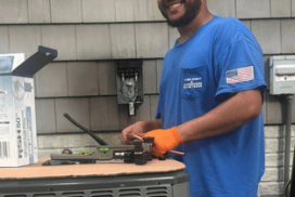 Fixed Right & Guaranteed technician working on an AC unit.