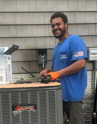 Fixed Right & Guaranteed technician working on an AC unit.