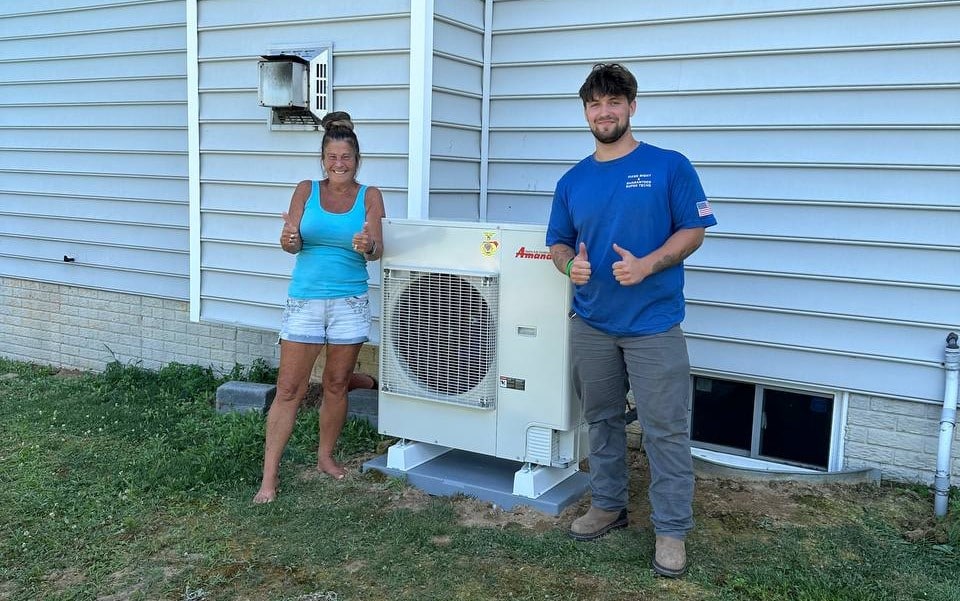 Technician With Customer And Ductless Mini Split Installation
